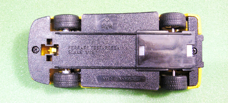 The pebbled base makes it hard to photograph the text on the base, at least for me. That switch controls the headlights...